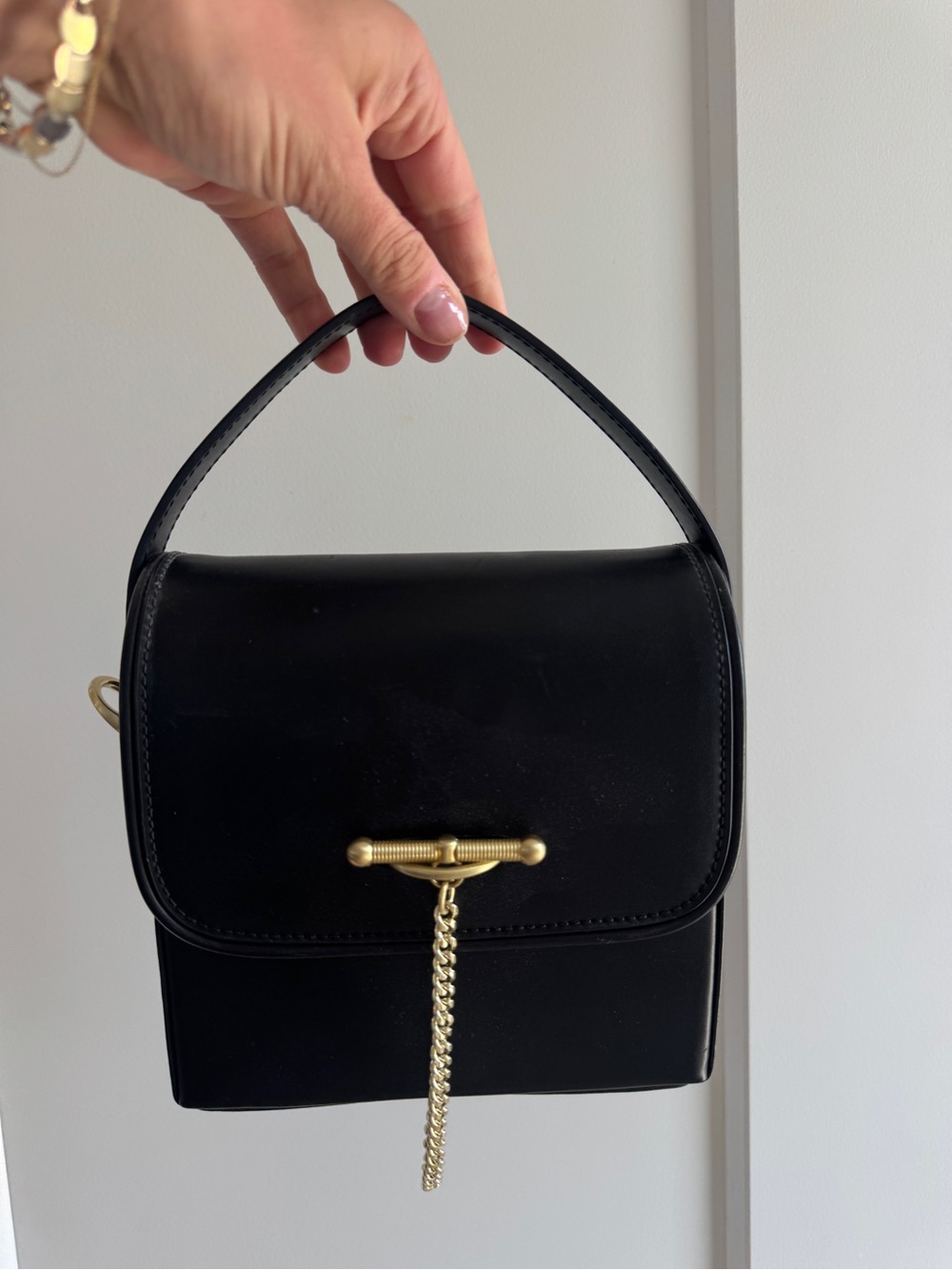 Sancia Black Leather Top-Handle Bag with Gold Chain Accent